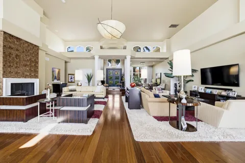 a bathroom with a double vanity sink mirror and shower