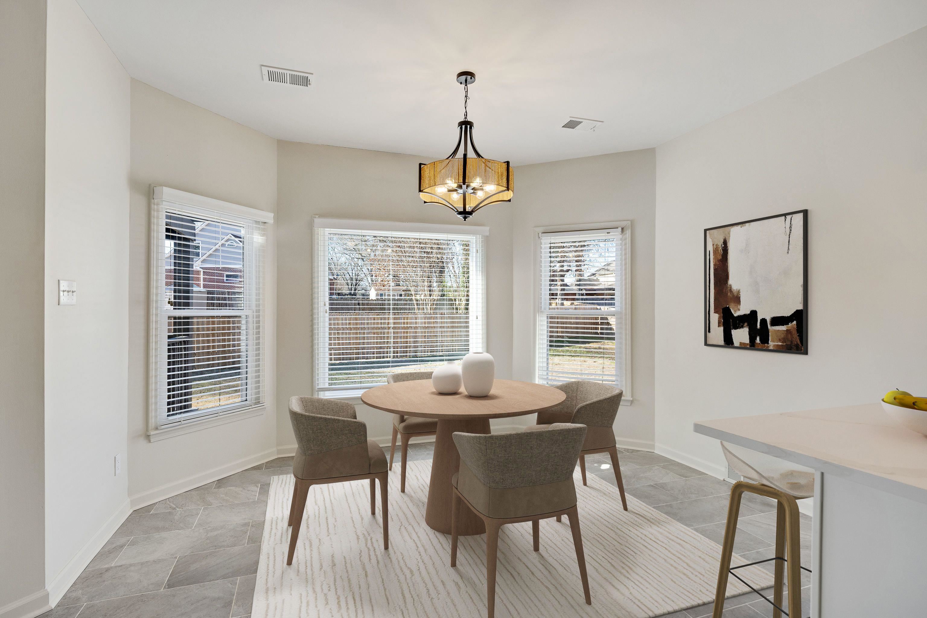 939 Fallen Oaks Drive Collierville, TN 38017 - Photo 11 of 23 a dining room with furniture a chandelier and wooden floor