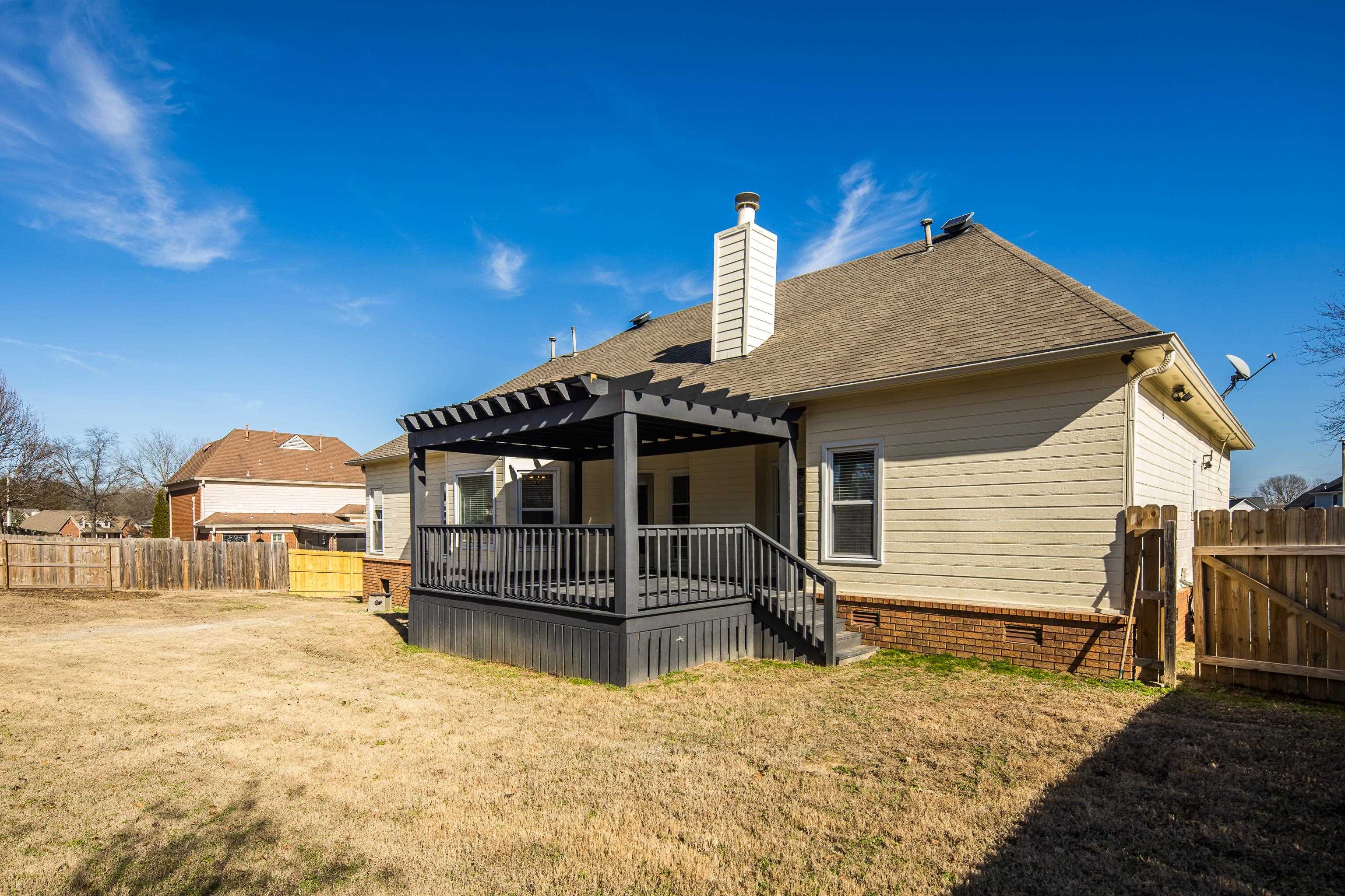 939 Fallen Oaks Drive Collierville, TN 38017 - Photo 22 of 23 a view of a house with a yard