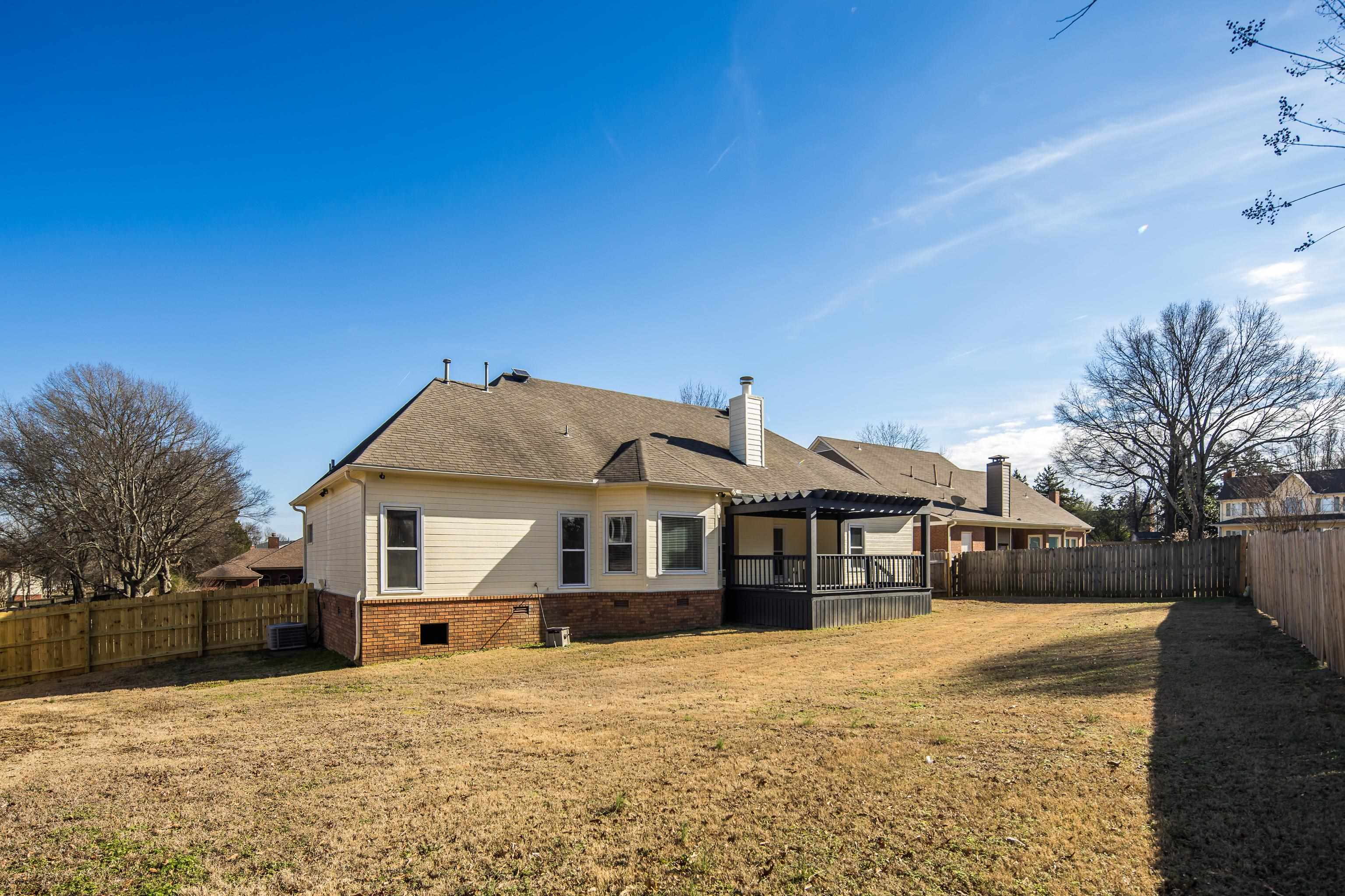 939 Fallen Oaks Drive Collierville, TN 38017 - Photo 23 of 23 a front view of a house with a yard