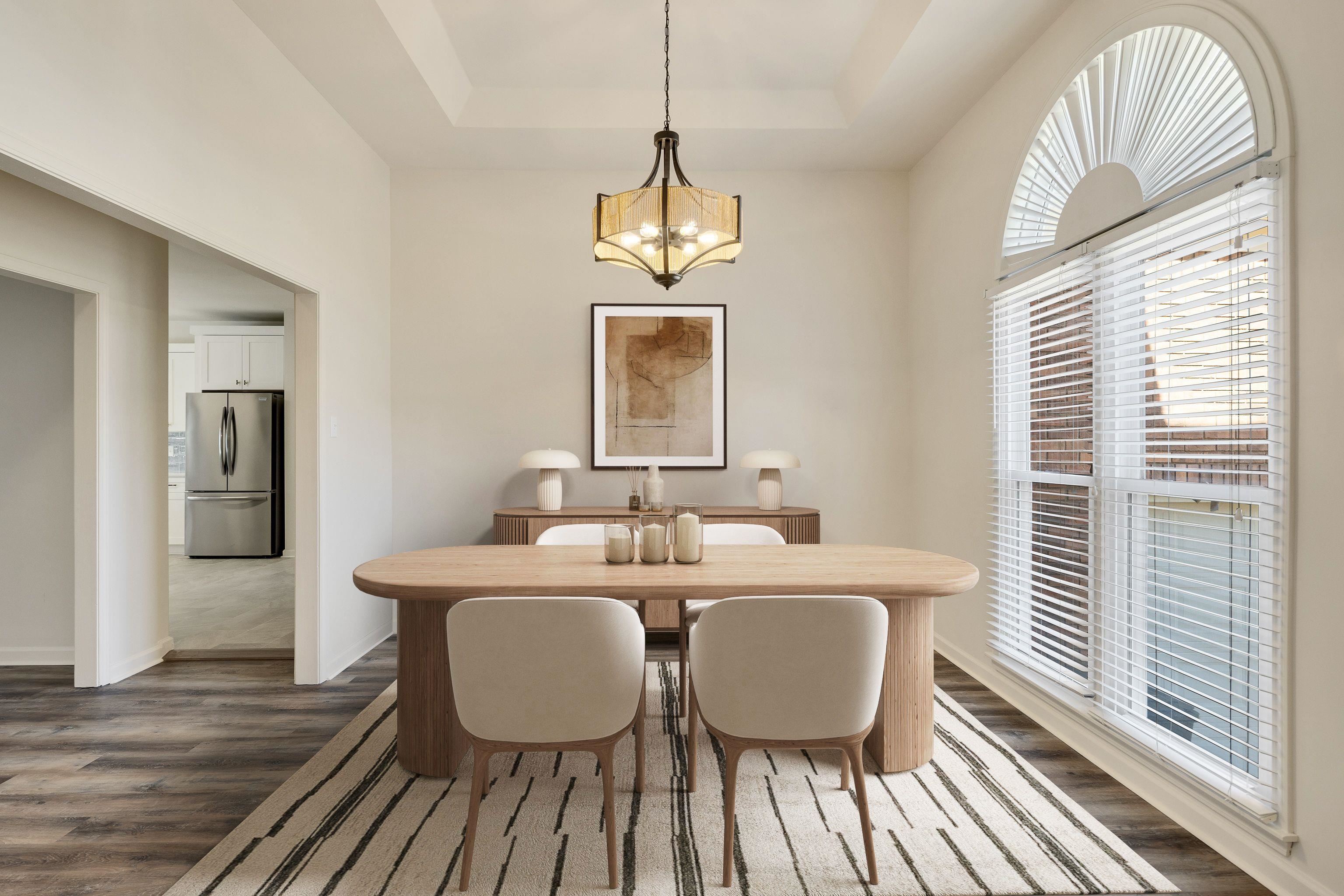 939 Fallen Oaks Drive Collierville, TN 38017 - Photo 5 of 23 a dining room with wooden floor a chandelier a wooden table and chairs