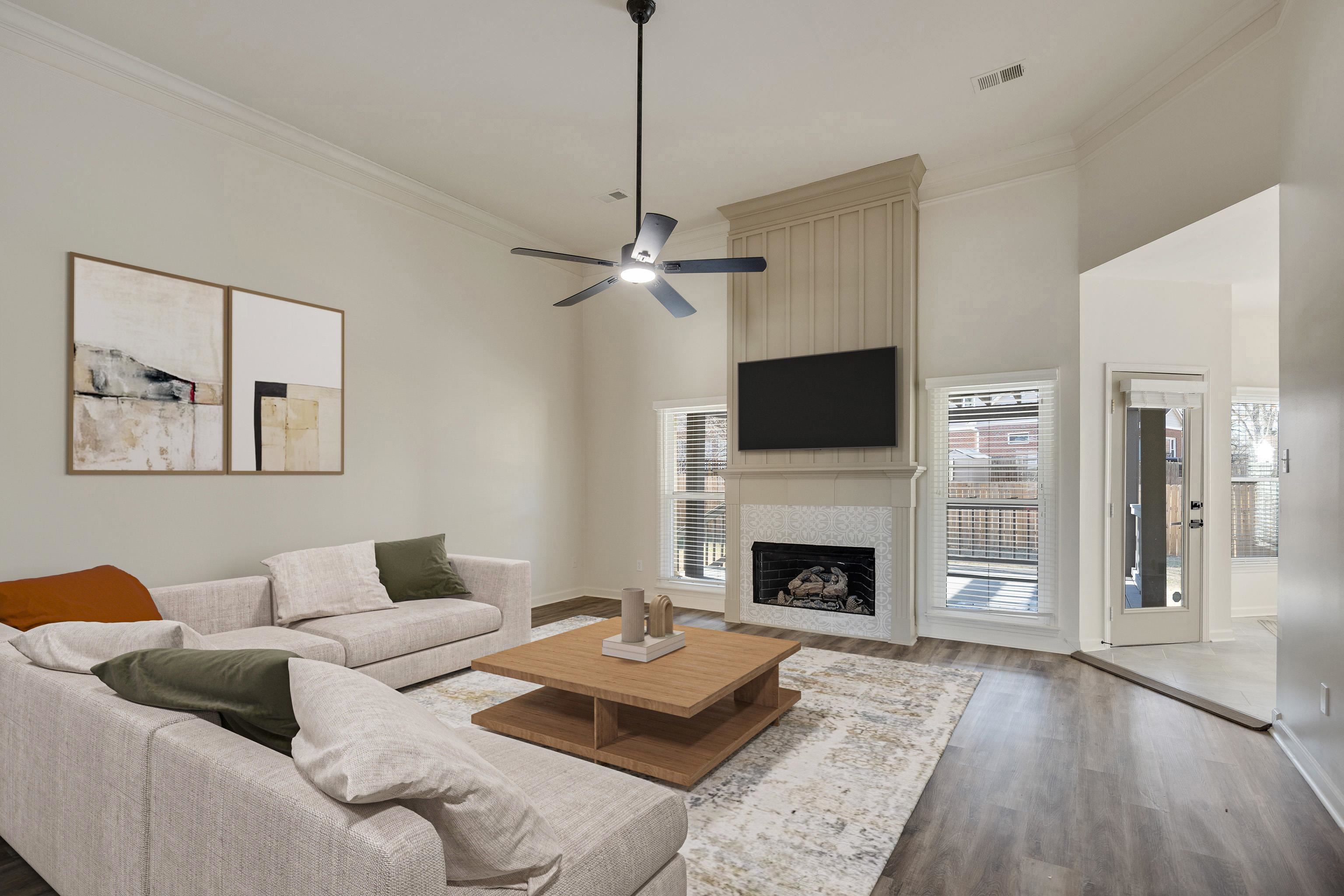 939 Fallen Oaks Drive Collierville, TN 38017 - Photo 7 of 23 a living room with furniture and a fireplace