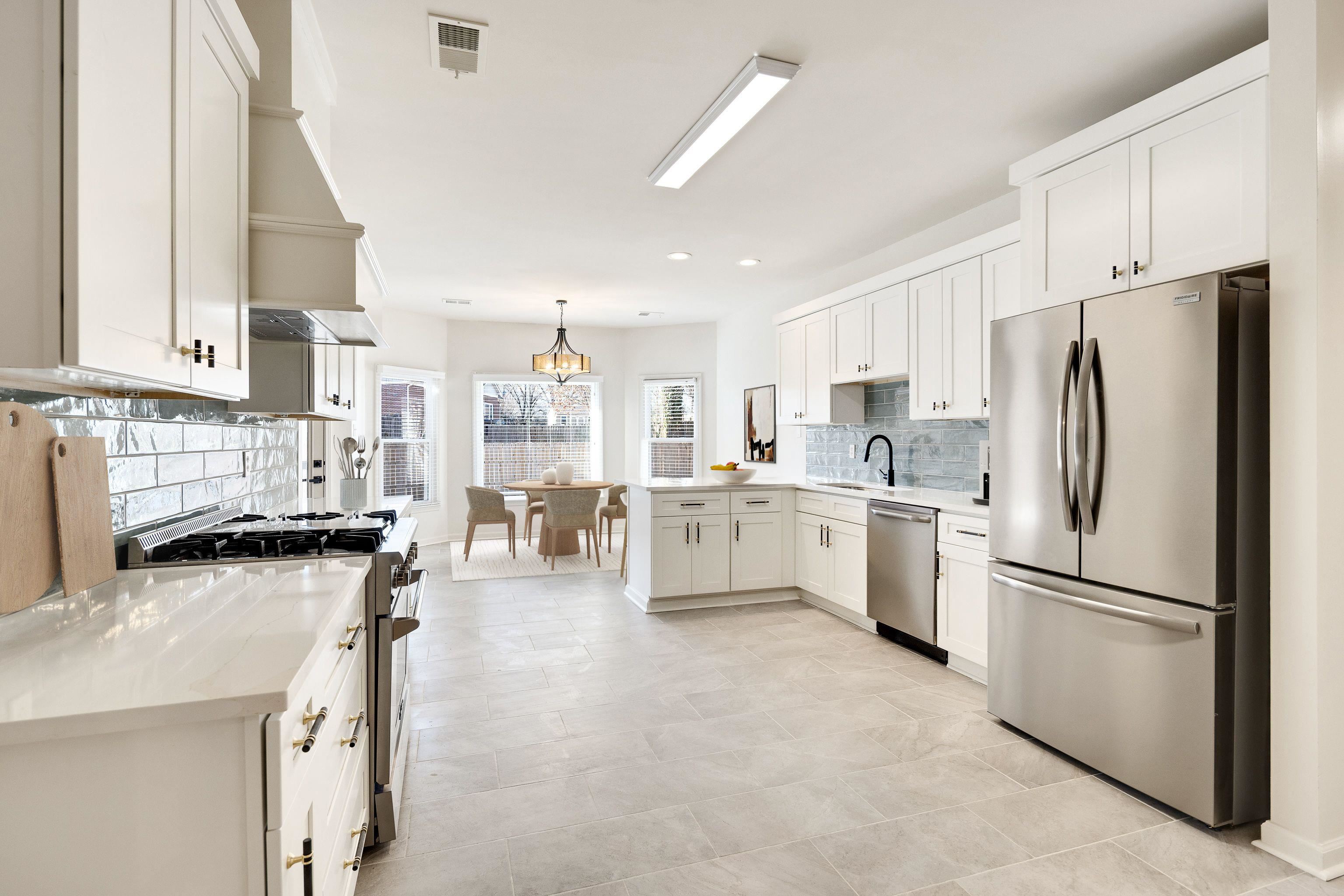 939 Fallen Oaks Drive Collierville, TN 38017 - Photo 10 of 23 a kitchen with stainless steel appliances a refrigerator sink and cabinets