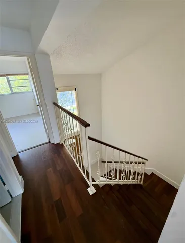 a view of entryway with wooden floor