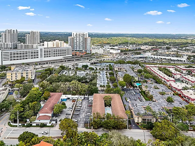 an aerial view of residential houses and city street