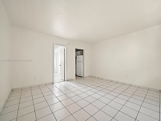 a view of an empty room and window