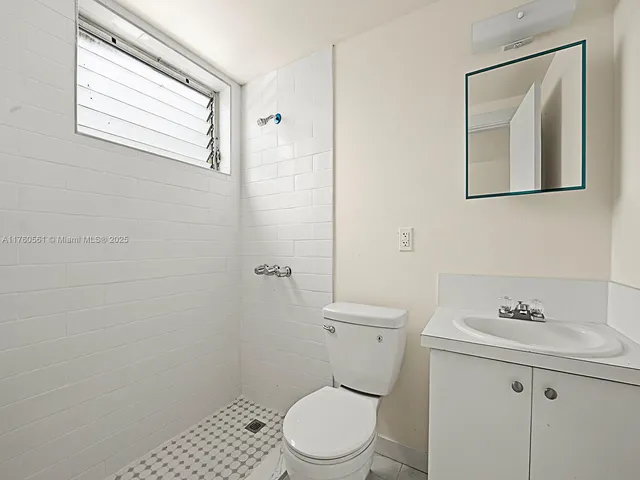 a view of a sink and dishwasher with wooden floor