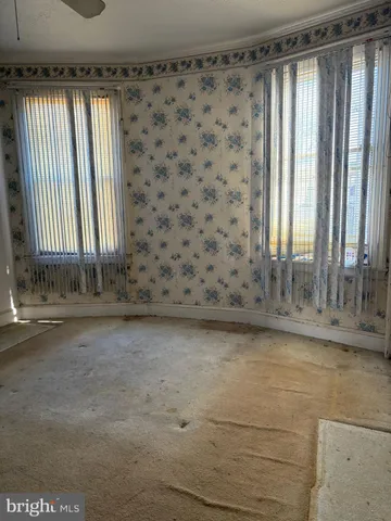 a view of wooden floor and a window