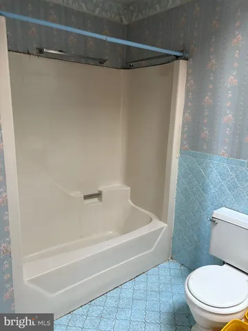 a view of empty room with window and door