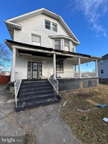 a front view of a house with a porch