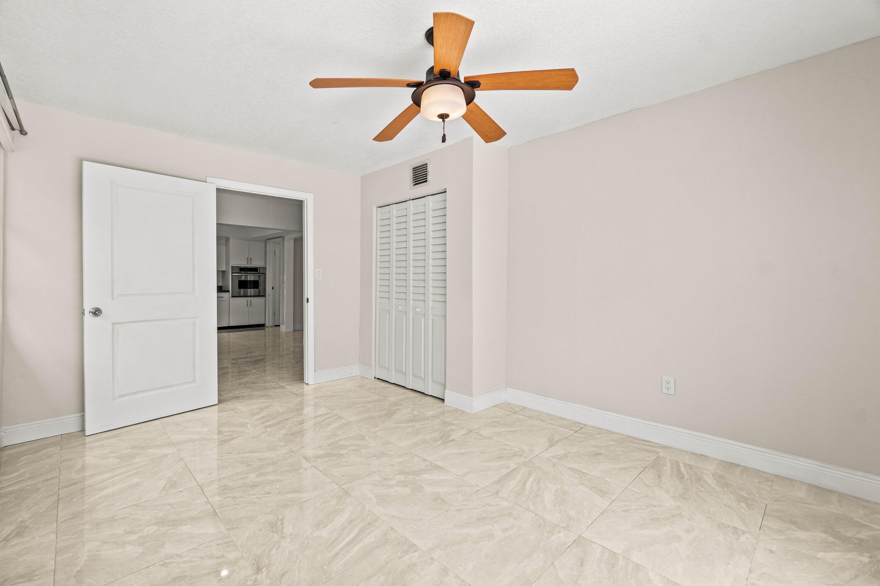 1290 Southwest 8th Street Boca Raton, FL 33486 - Photo 17 of 29 a view of empty room with ceiling fan