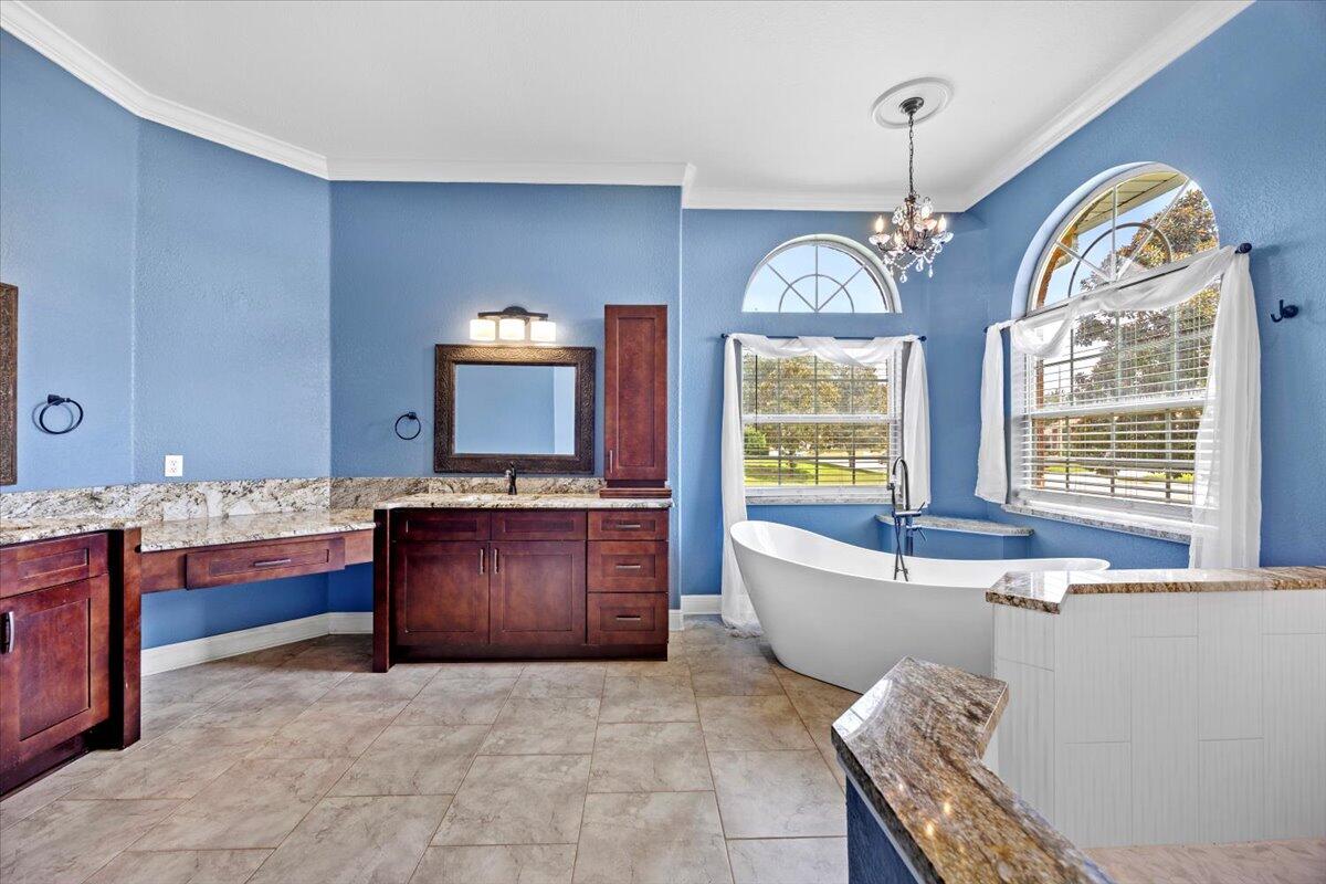 2691 Stormy Circle Navarre, FL 32566 - Photo 11 of 47 a living room with furniture and a chandelier