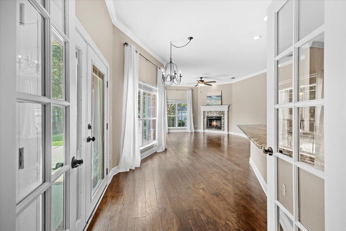 2691 Stormy Circle Navarre, FL 32566 - Photo 16 of 47 a view of a hallway view with wooden floor and staircase