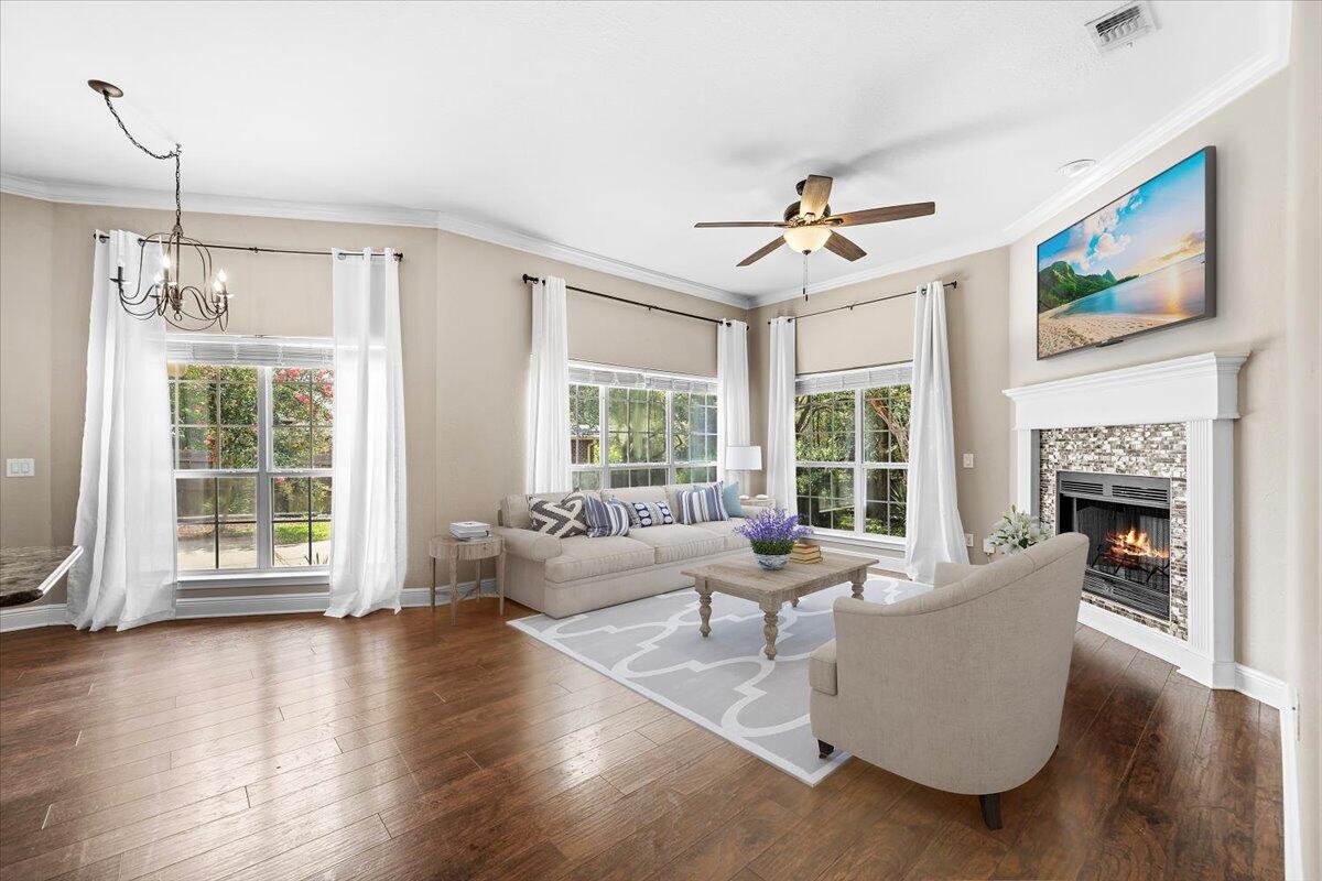 2691 Stormy Circle Navarre, FL 32566 - Photo 18 of 47 a living room with furniture large window and wooden floor
