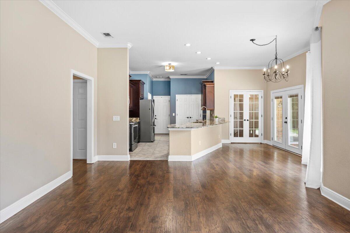 2691 Stormy Circle Navarre, FL 32566 - Photo 19 of 47 a view of a kitchen with wooden floor and a kitchen