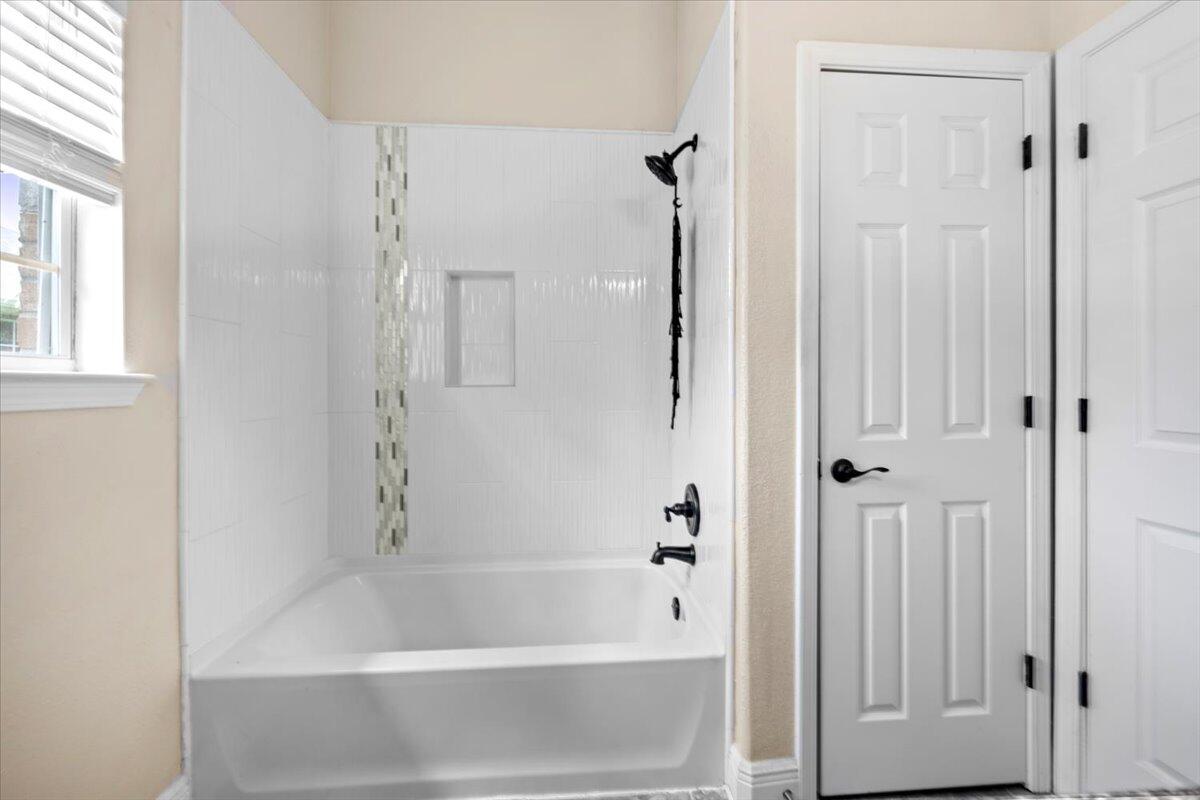 2691 Stormy Circle Navarre, FL 32566 - Photo 28 of 47 a bathroom with a bathtub