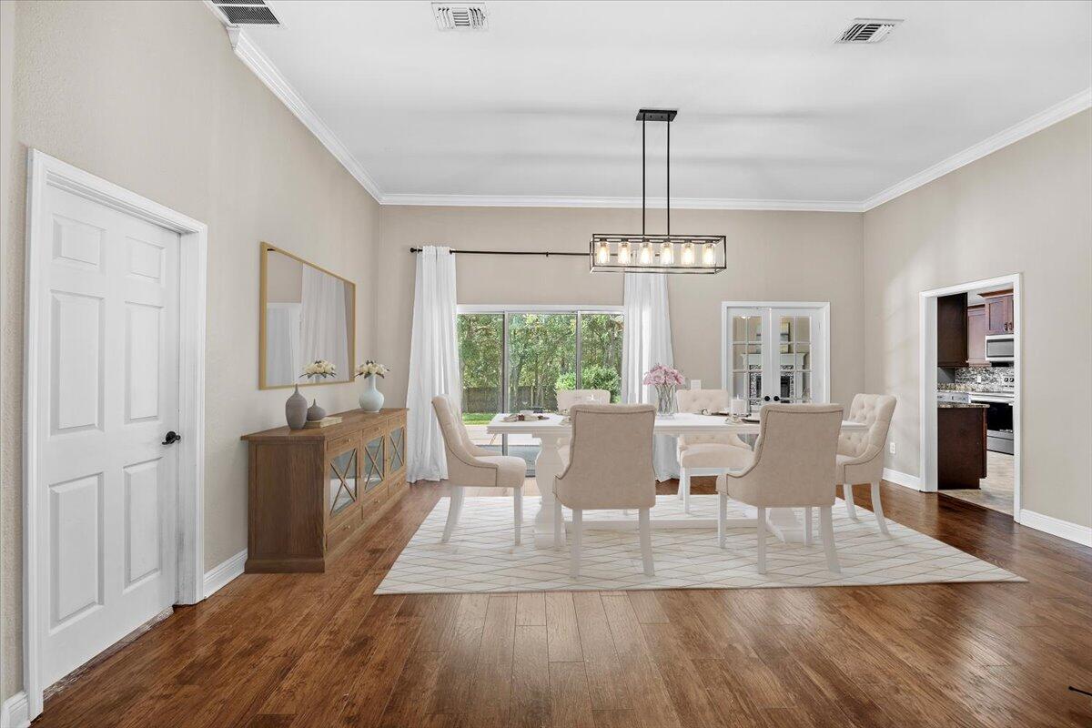2691 Stormy Circle Navarre, FL 32566 - Photo 4 of 47 a view of a dining room with furniture window and wooden floor
