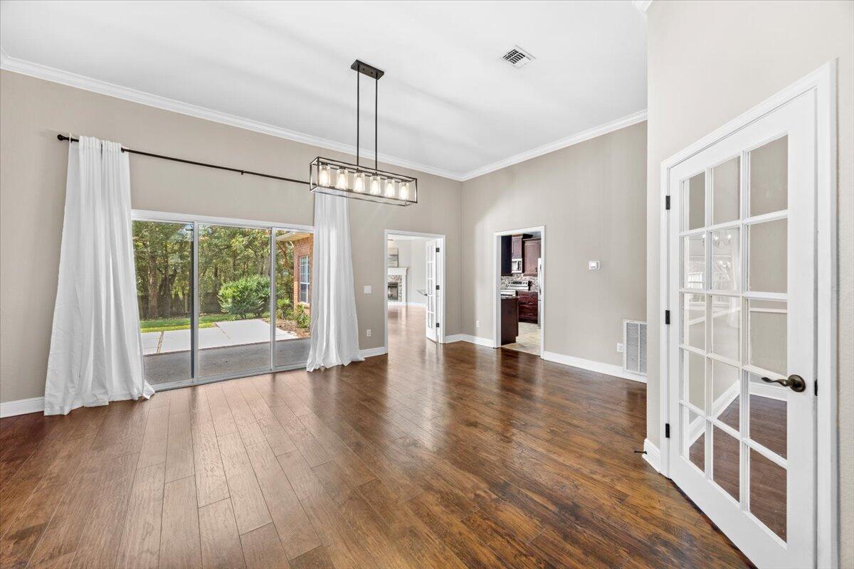 2691 Stormy Circle Navarre, FL 32566 - Photo 6 of 47 a view of empty room with wooden floor and fan