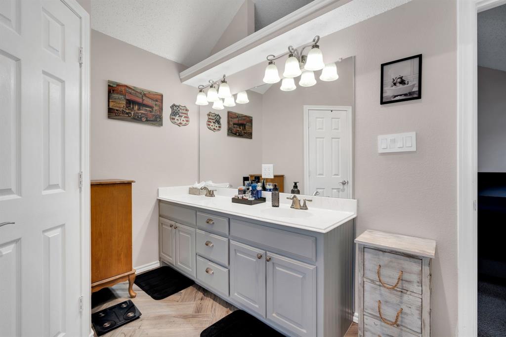 1001 Short Line Boulevard Midlothian, TX 76065 - Photo 13 of 26 Double vanity with a white countertop and gray cabinetry