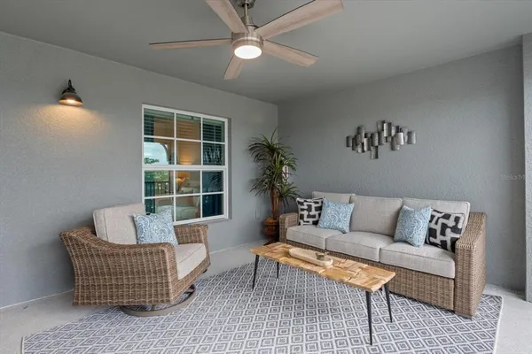 a living room with furniture and a window