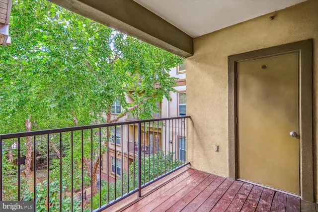 a view of balcony with wooden floor