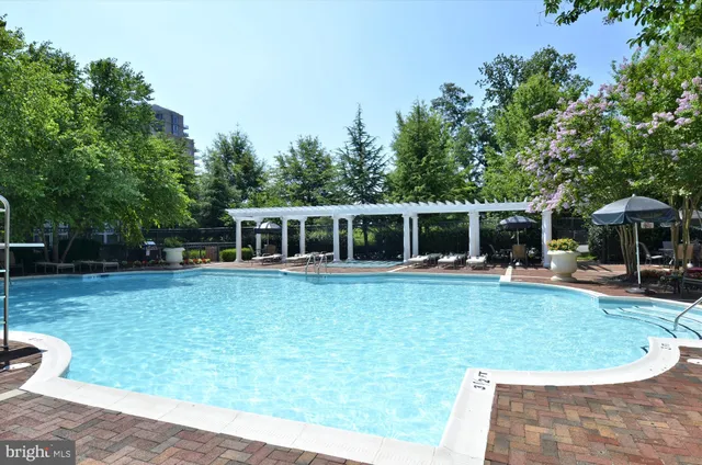 a view of a swimming pool with a patio