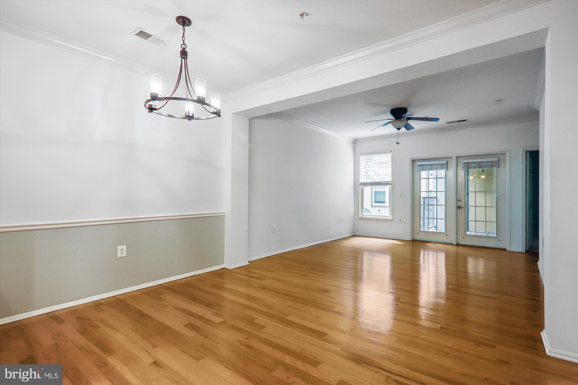 11800 Old Georgetown Road, Unit 1424 Rockville, MD 20852 - Photo 8 of 34 a view of empty room with wooden floor and window