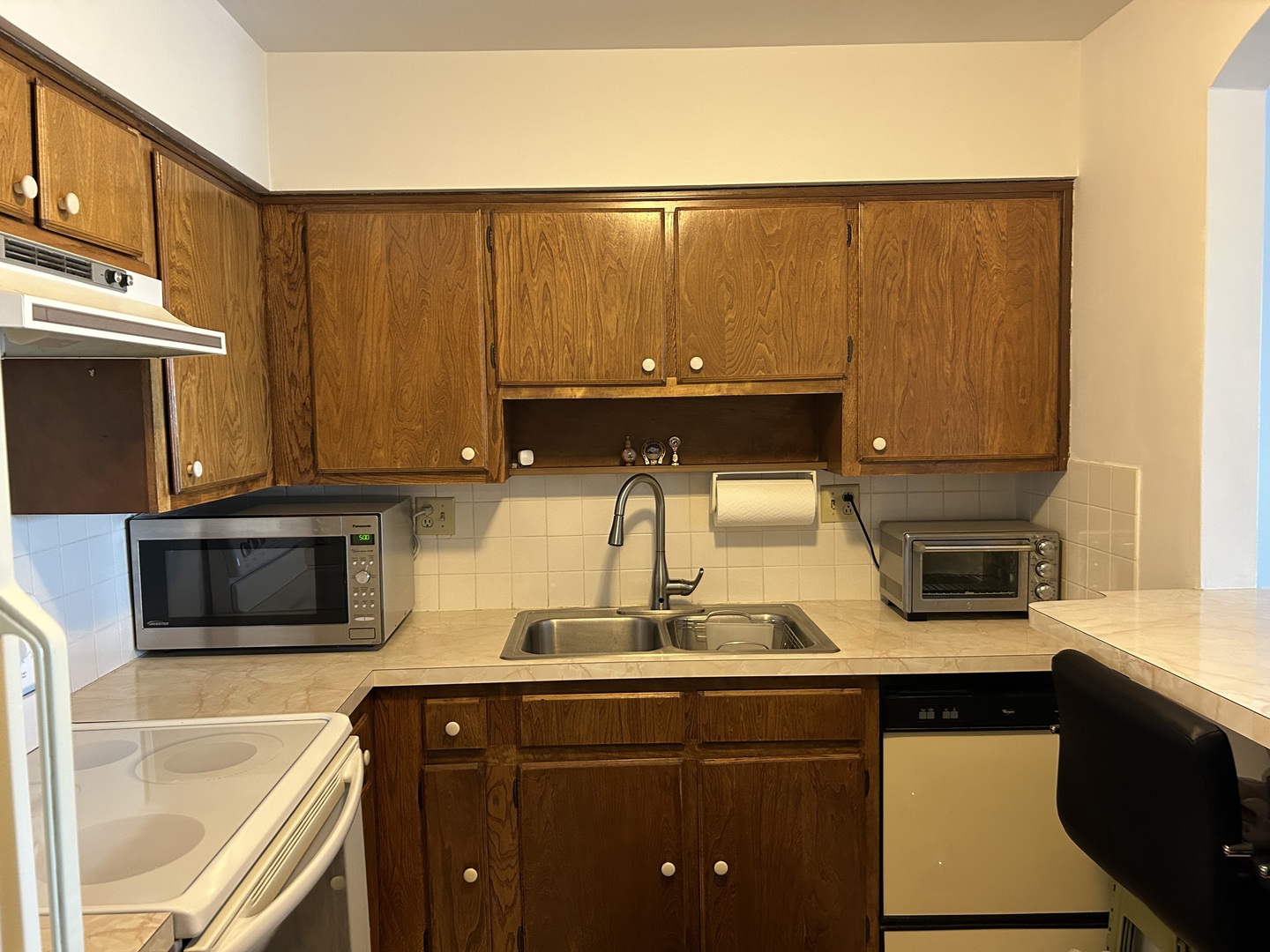 701 West Huntington Commons Road, Unit 410 Mount Prospect, IL 60056 - Photo 8 of 22 a kitchen with a sink and a microwave