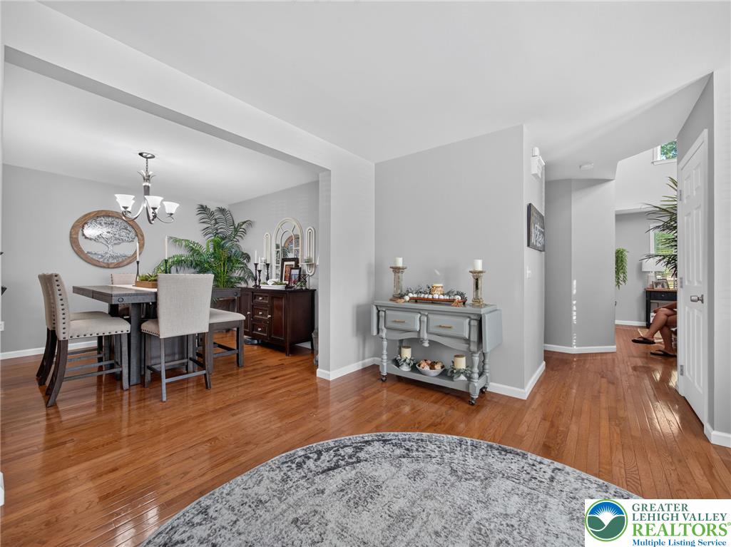 4148 Ross Road Bethlehem, PA 18020 - Photo 46 of 67 Rich hardwood floors unite the dining space and entry, creating a seamless flow.