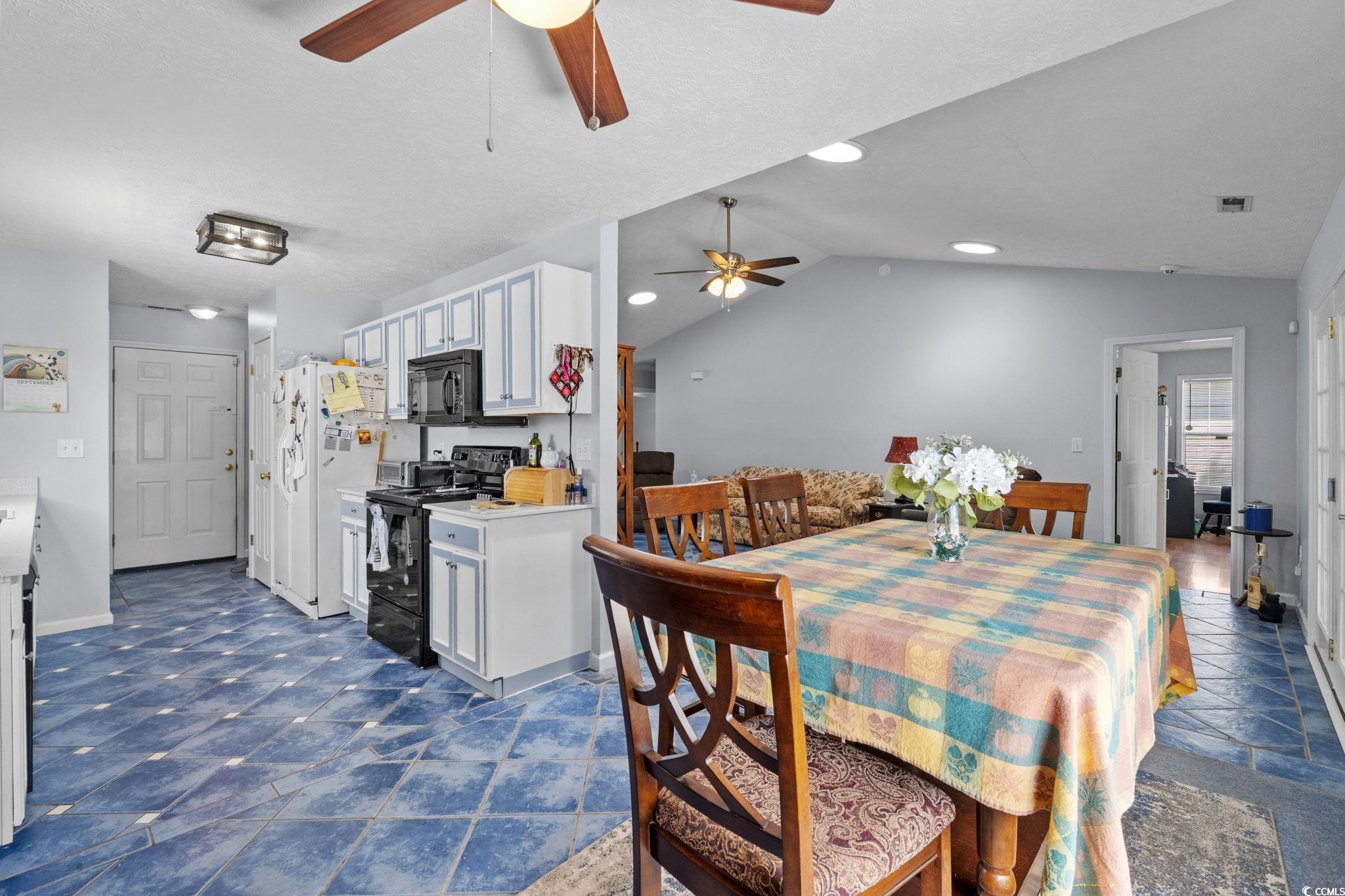8069 Resin Road Murrells Inlet, SC 29576 - Photo 14 of 40 Dining space featuring vaulted ceiling and recessed lighting