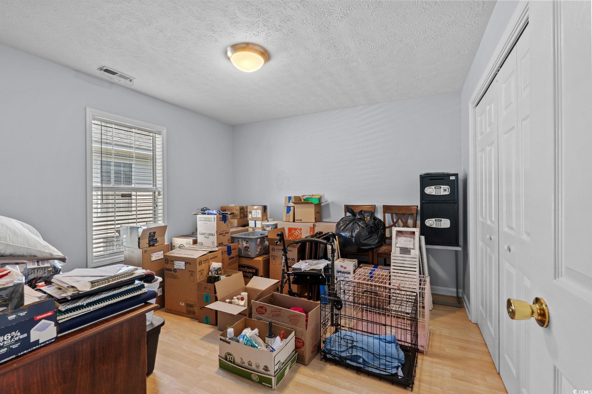 8069 Resin Road Murrells Inlet, SC 29576 - Photo 24 of 40 Office with light wood finished floors and a textured ceiling