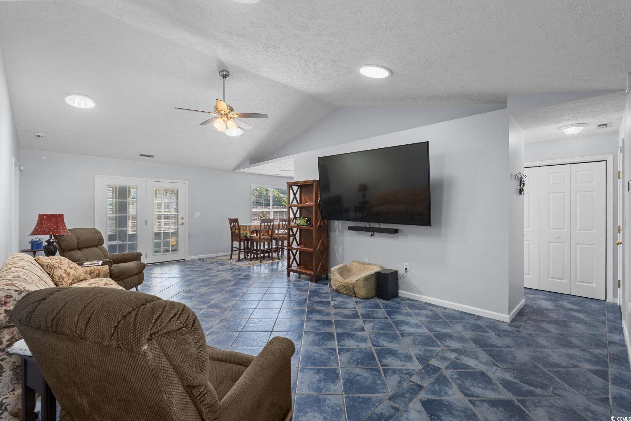 8069 Resin Road Murrells Inlet, SC 29576 - Photo 6 of 40 Living area with vaulted ceiling, a textured ceiling, a ceiling fan, and recessed lighting
