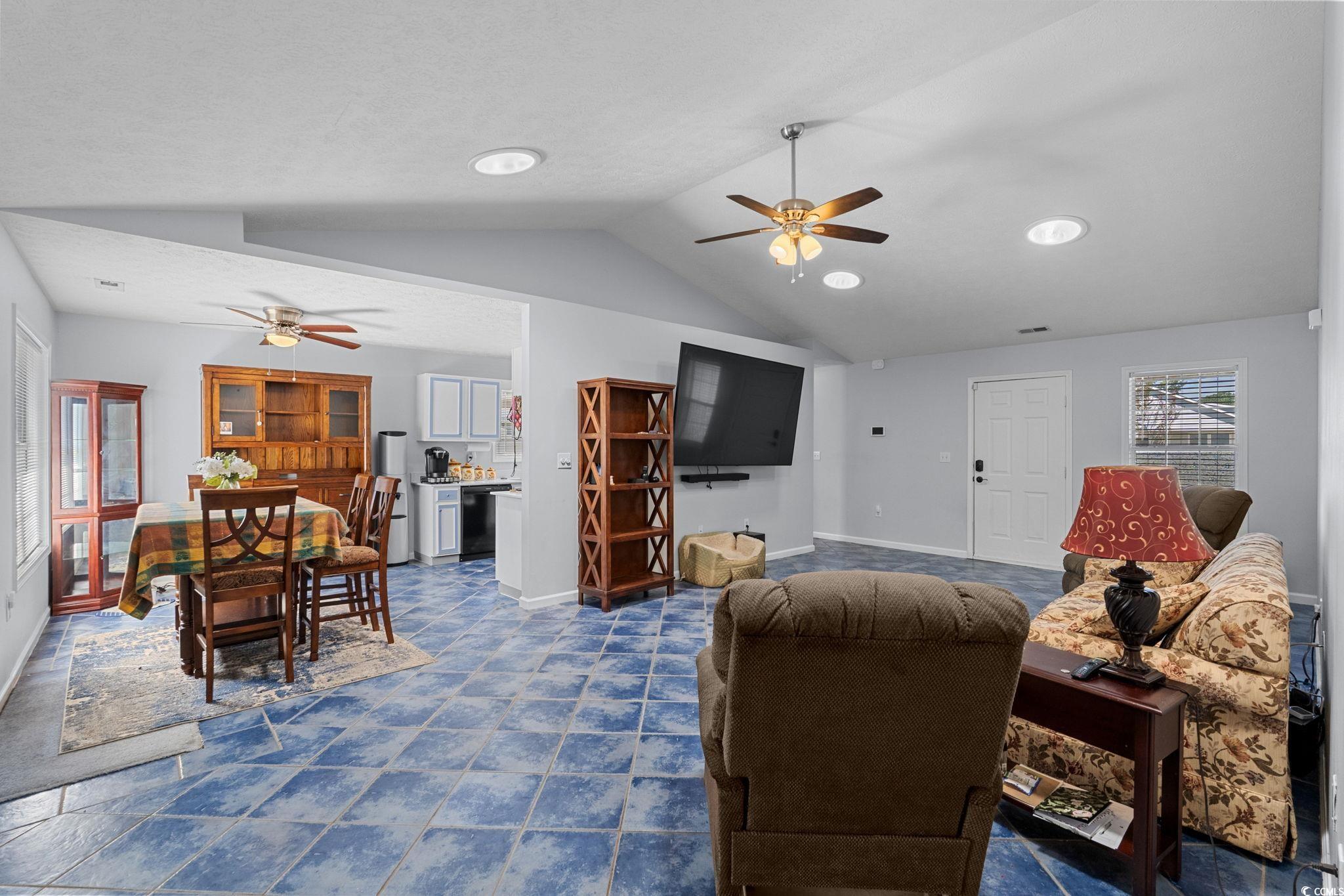 8069 Resin Road Murrells Inlet, SC 29576 - Photo 8 of 40 Living room with ceiling fan, lofted ceiling, and recessed lighting