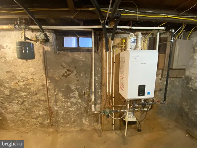 a view of a porch with a table and chairs