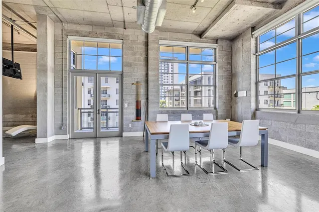 a view of a dining room with furniture and window