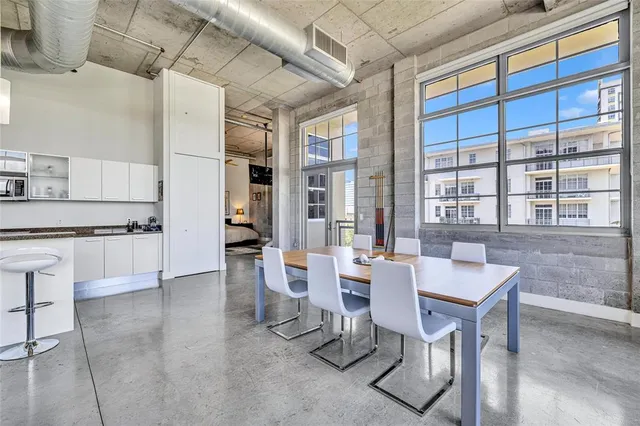 a kitchen with stainless steel appliances granite countertop a sink and cabinets