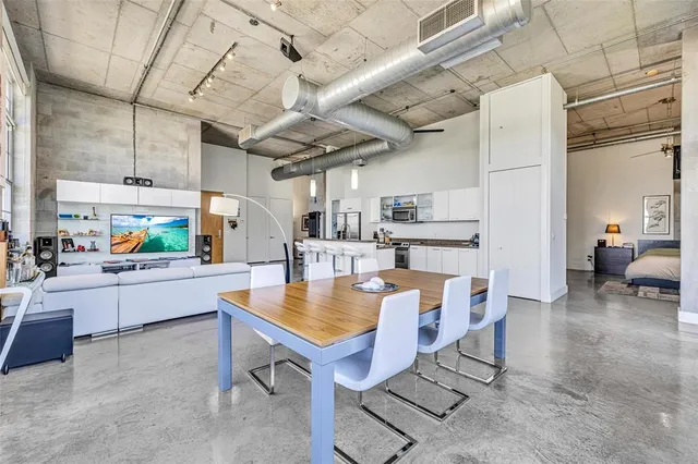 a large kitchen with a stove and a sink