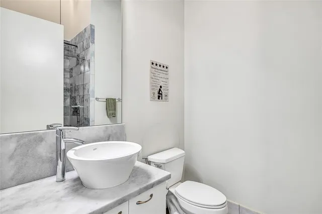 an aerial view of multi story residential apartment building with yard