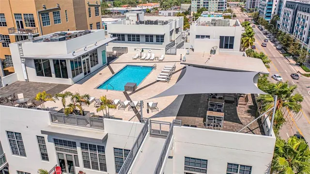 a view of a patio with table and chairs and potted plants