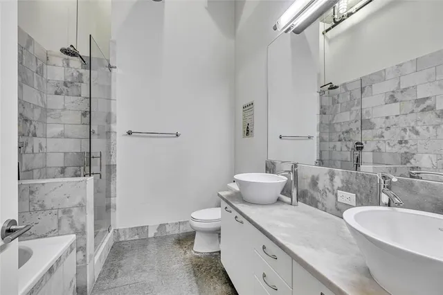 a lobby with furniture and floor to ceiling window