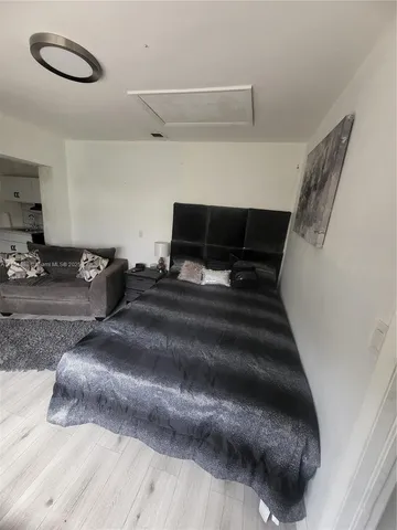 a bedroom with a bed and cabinets