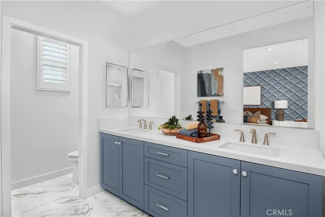 a view of bathroom with sink and mirror