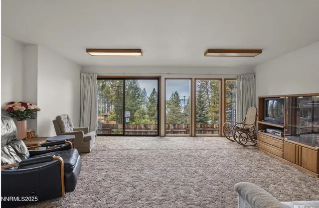 a room with furniture and a flat screen tv