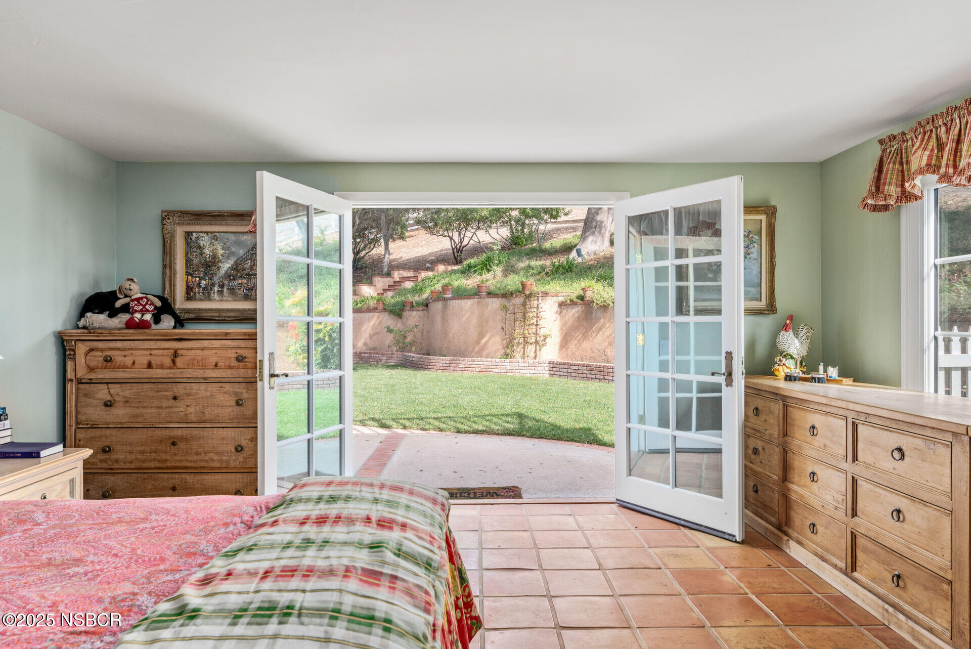 4086 East Oak Trail Road Santa Ynez, CA 93460 - Photo 17 of 57 a bedroom with a bed and wooden floor