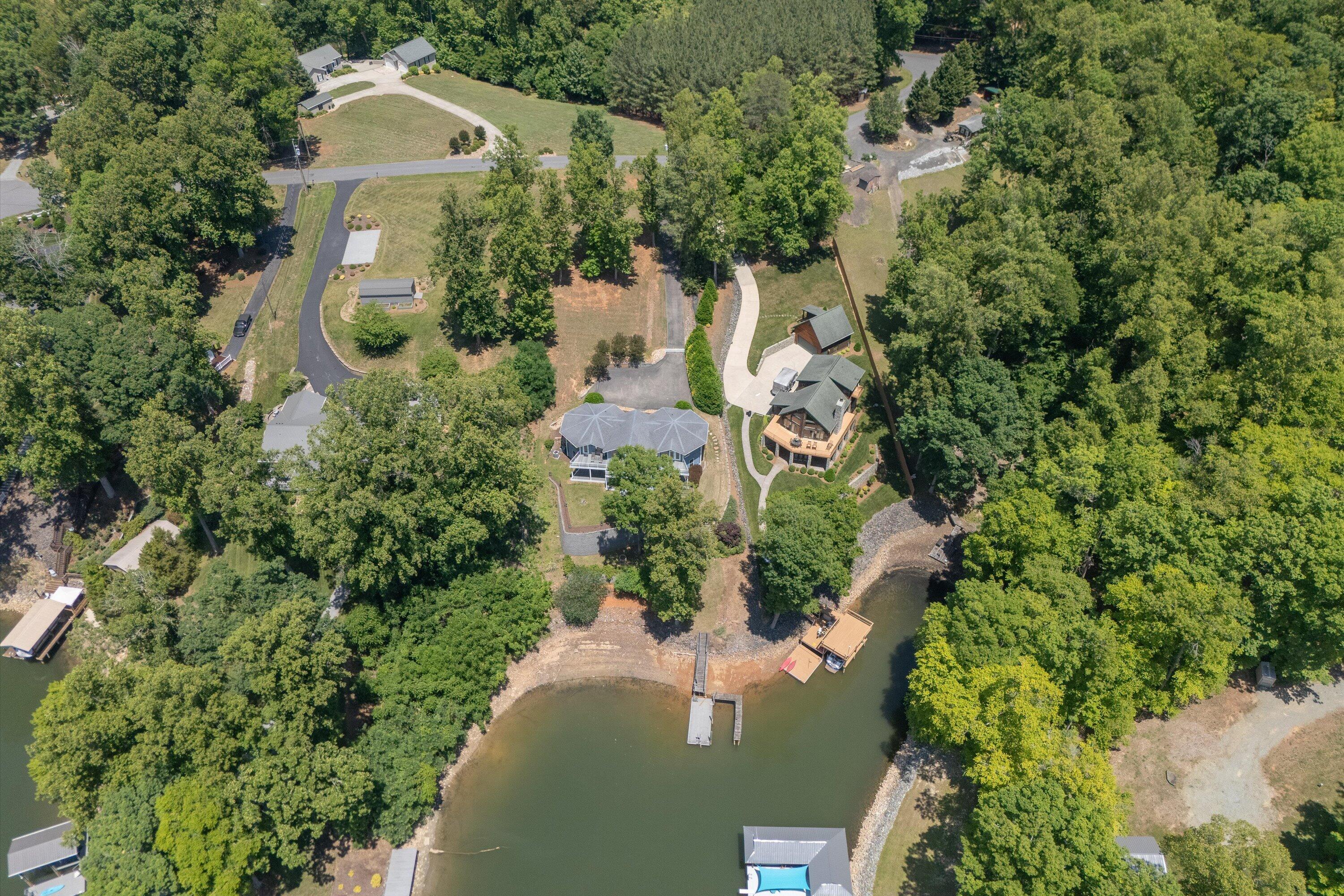 207 Winding Way Union Hall, VA 24176 - Photo 57 of 60 an aerial view of a house with a yard and lake view