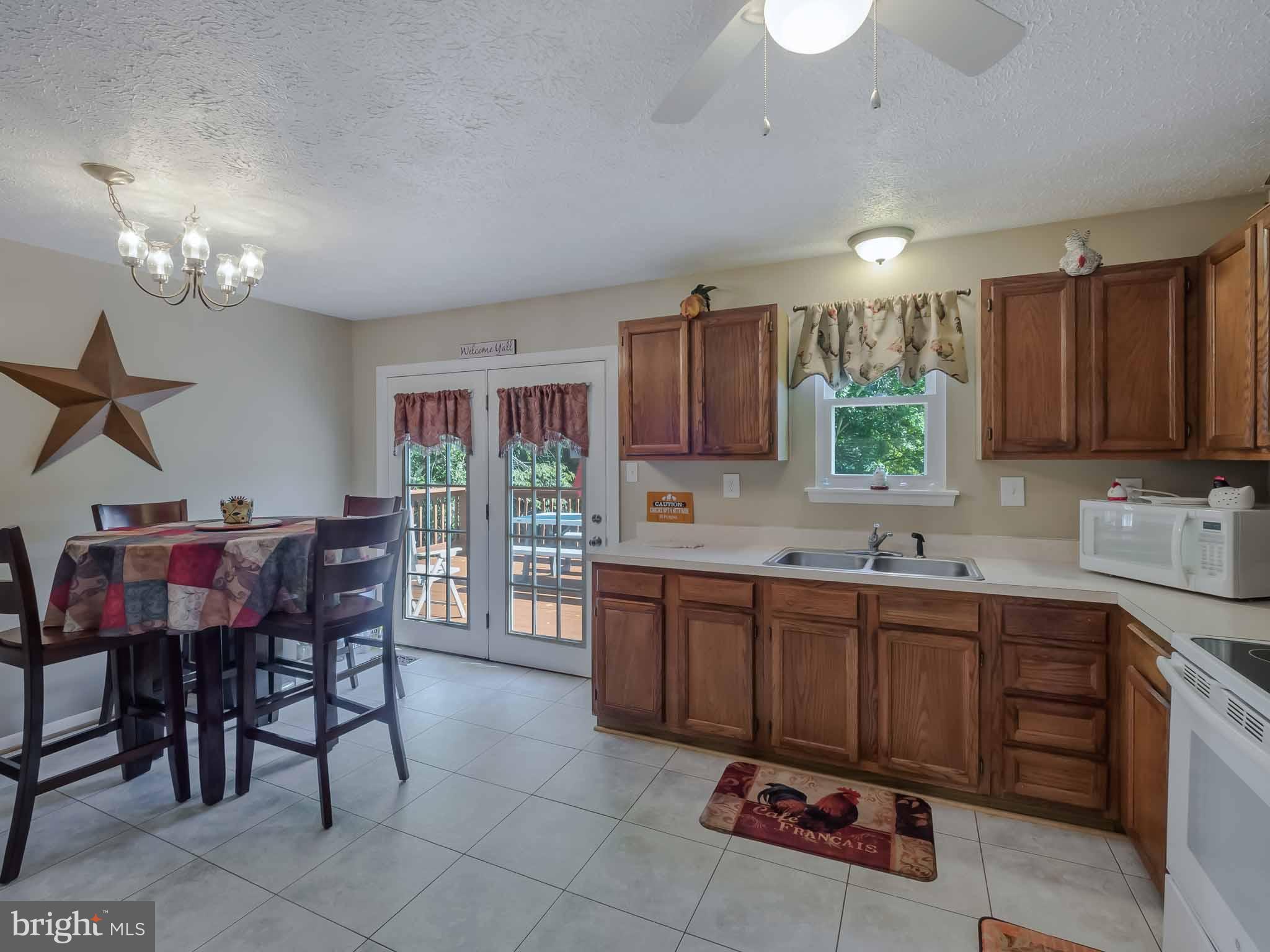 17364 Teagues Point Road Hughesville, MD 20637 - Photo 15 of 30 iEat in kitchen w/French Doors to back deck