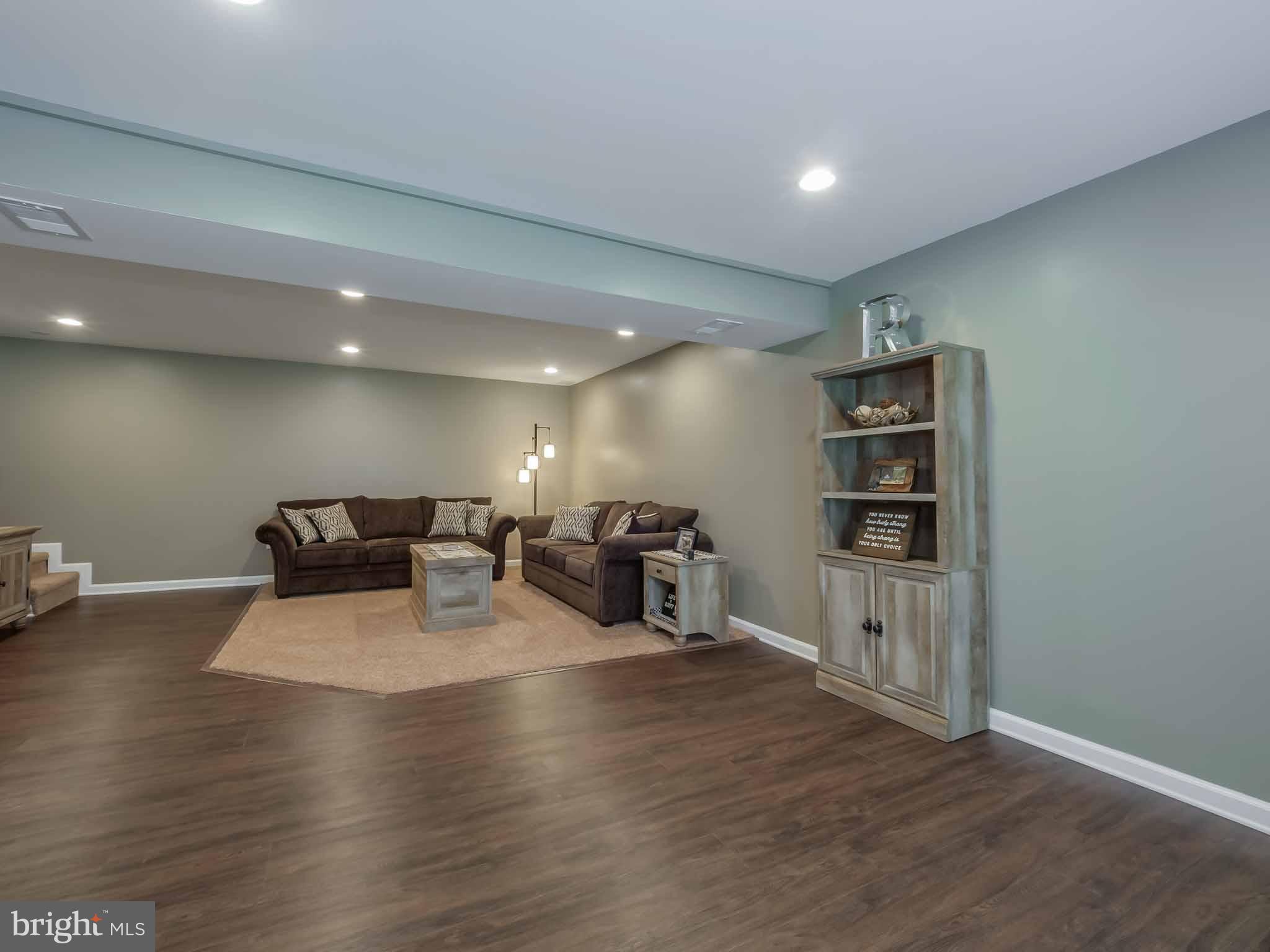 17364 Teagues Point Road Hughesville, MD 20637 - Photo 21 of 30 Lower level family room with new engineered floori
