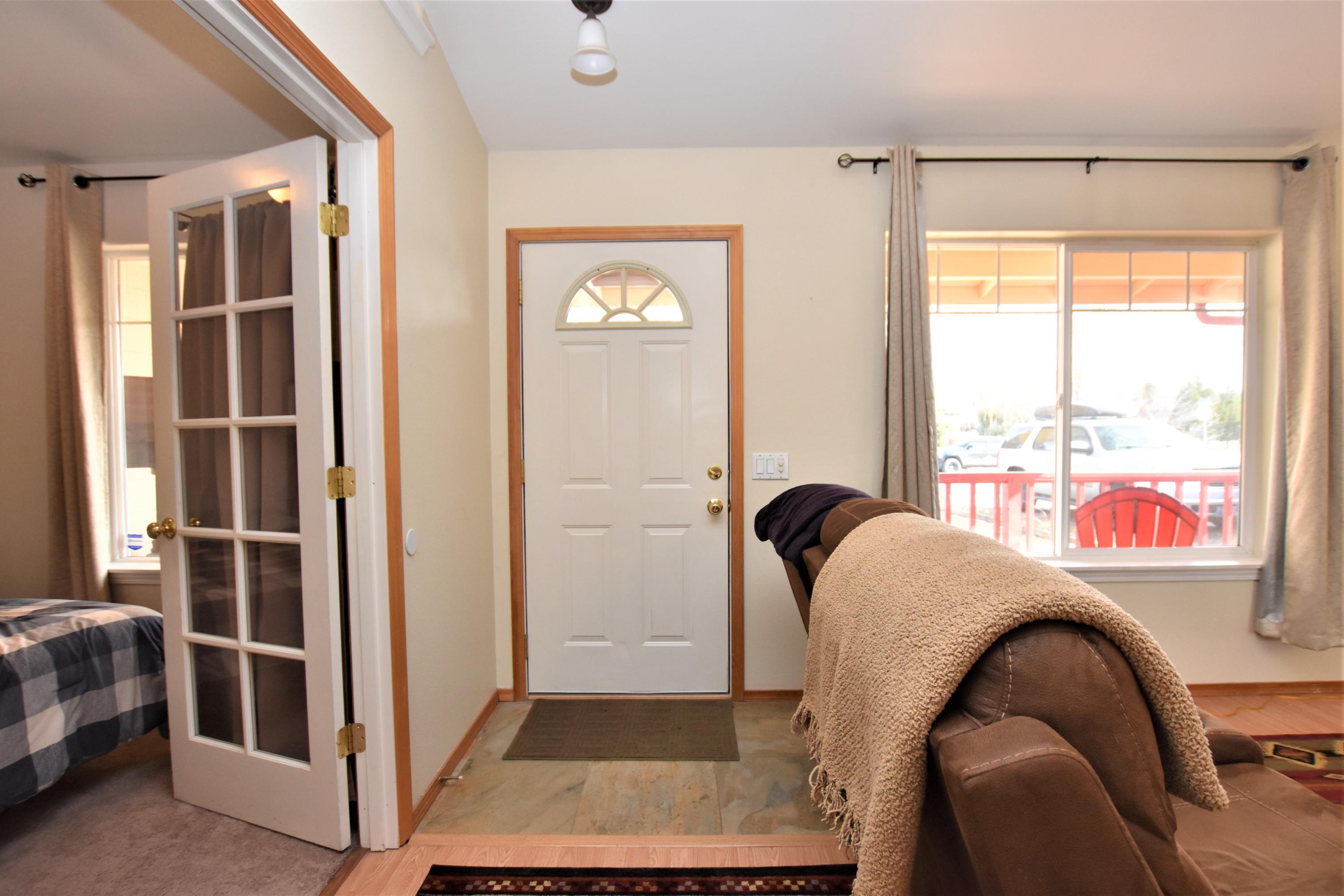 62645 Hawkview Road Bend, OR 97701 - Photo 5 of 22 a living room with furniture and a window