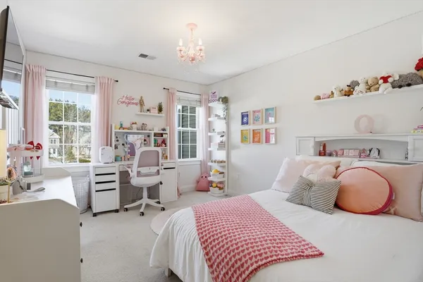 a bedroom with a bed and furniture