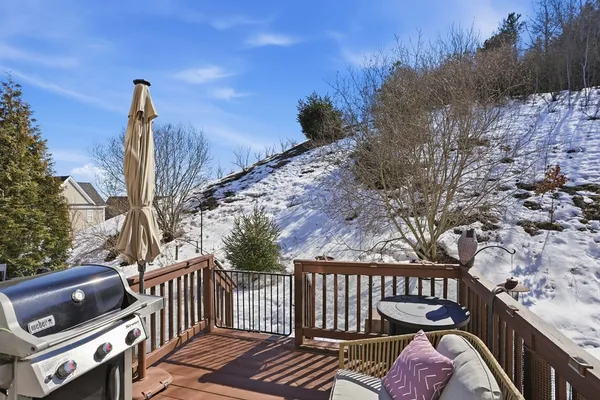 a view of balcony with wooden floor and outdoor seating